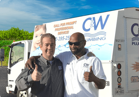 c&w employees thumbs up in front of truck